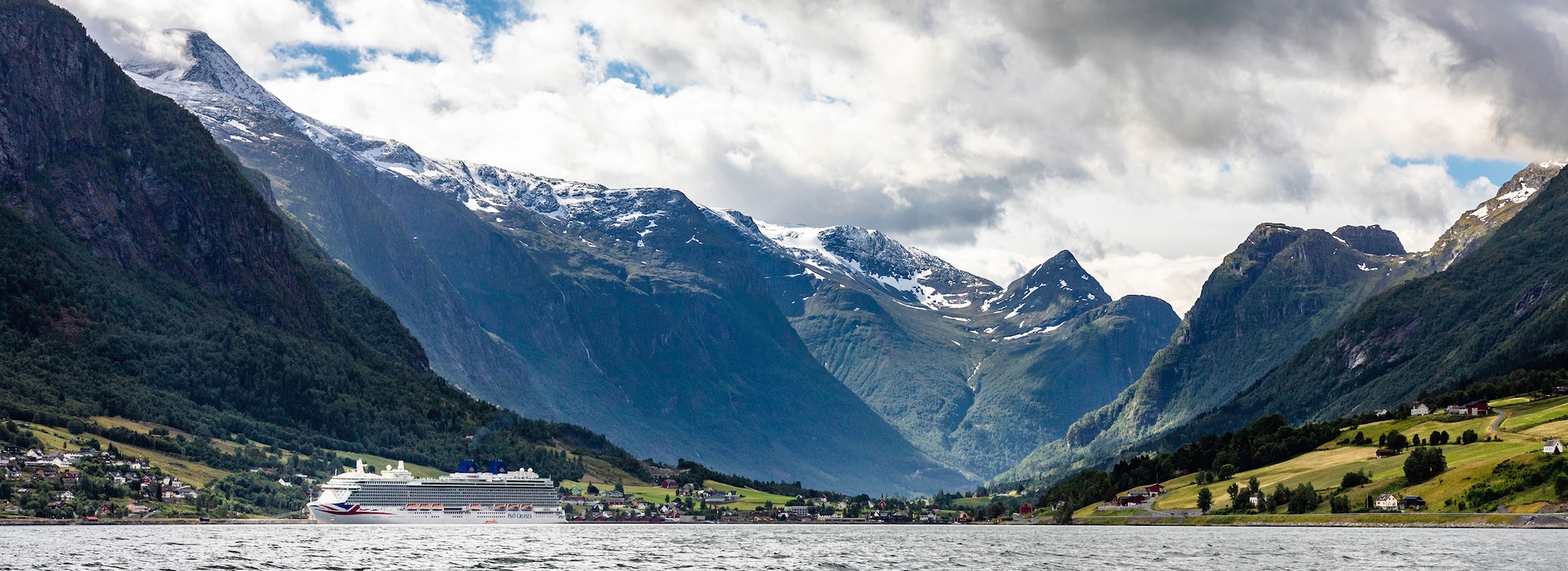 P&O Cruises Ship, Britannia in front of the mountains in Olden, Norway