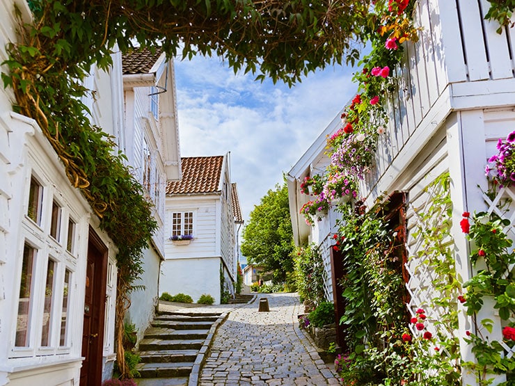 Cobbled path between white cottages in Old Stavanger