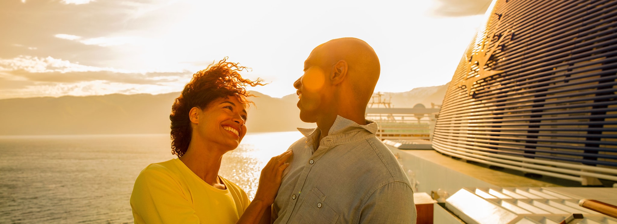 {"metadata_en_GB":{"alt-text":"Couple on deck on-board"},"metadata_en_AU":{"alt-text":"Couple on deck on-board"}}